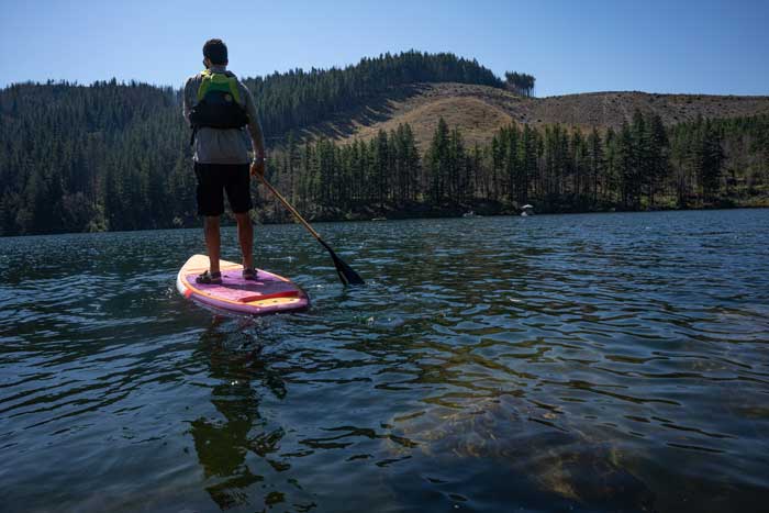 Paddling a Level 6 Touring SUP on flatwater